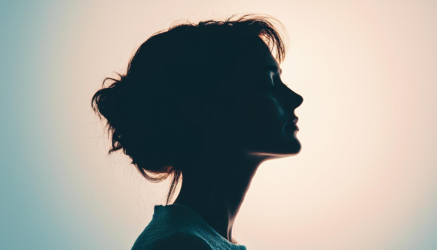 Moody backlight portrait of a beautiful woman studio photography artistic profile view photo