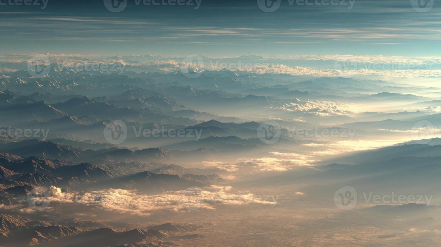 Aerial View of Mountain Range at Sunrise with Golden Clouds photo