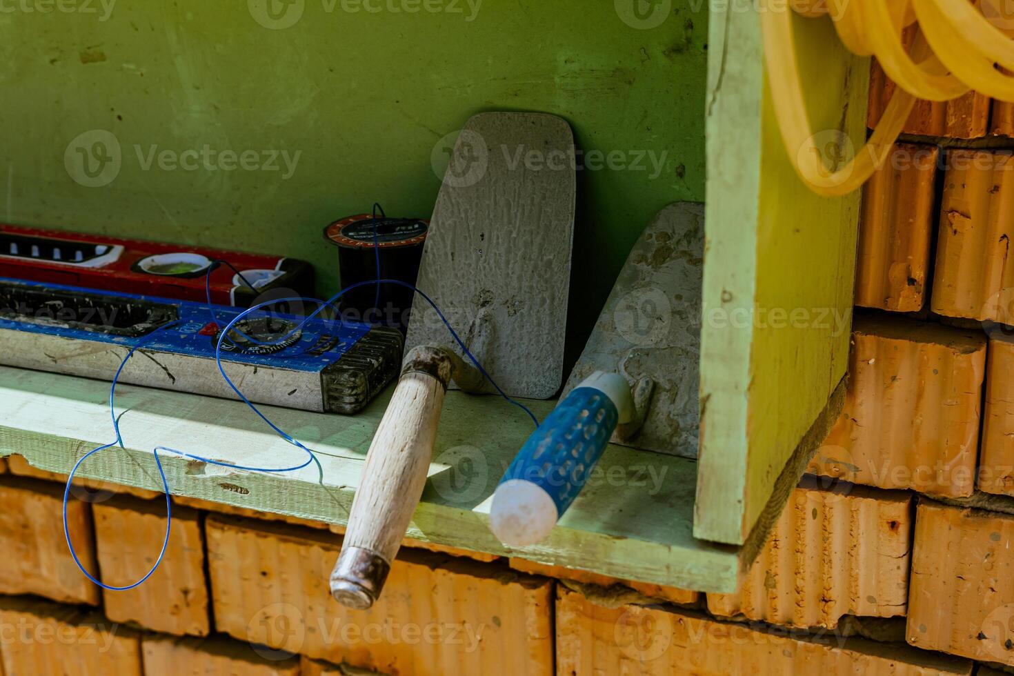 A shelf with tools and a hose on it photo