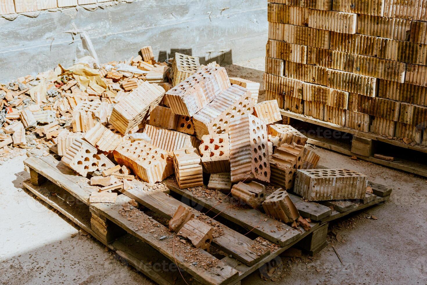 A pile of bricks on a pallet photo