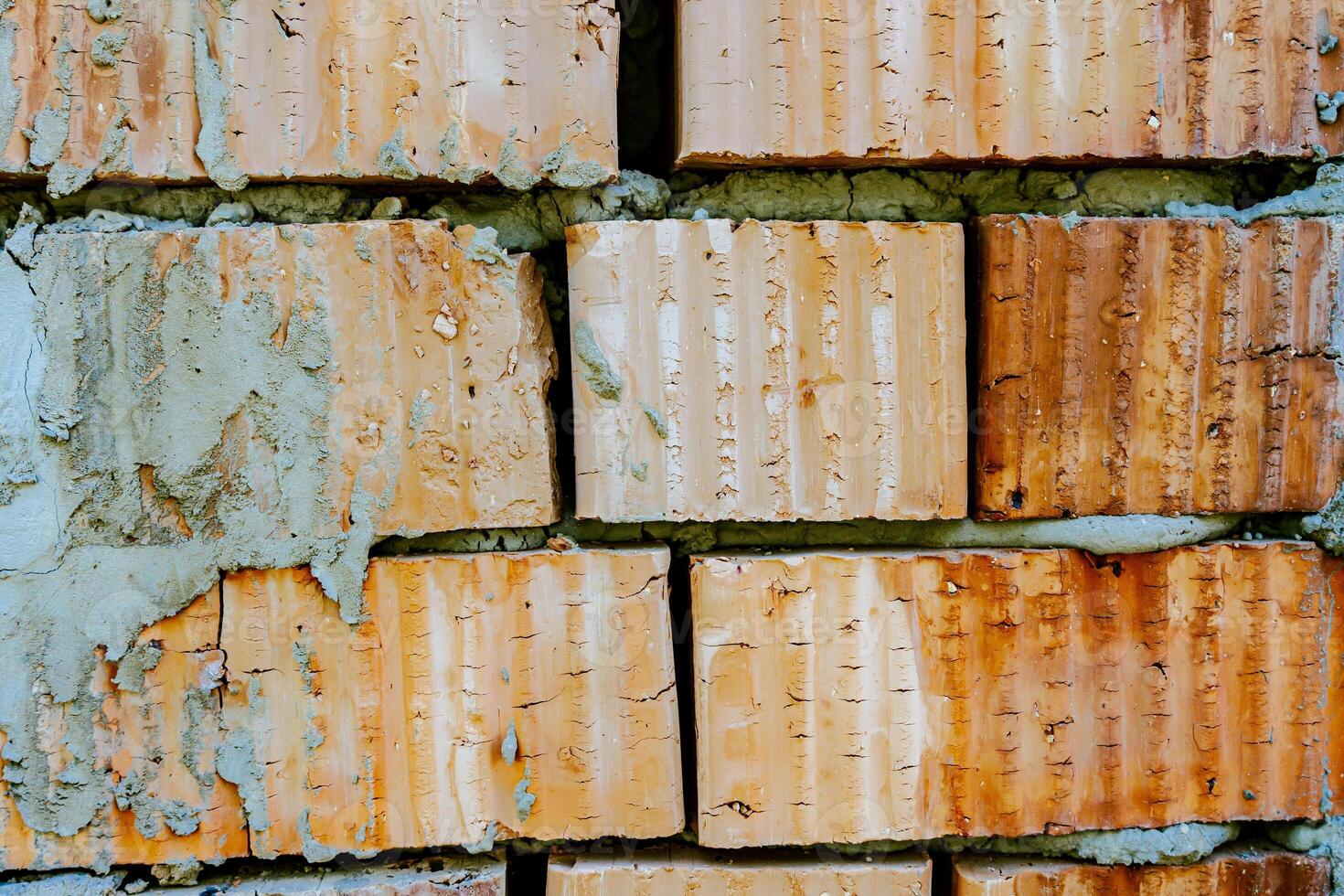 A close up of a brick wall with paint on it photo