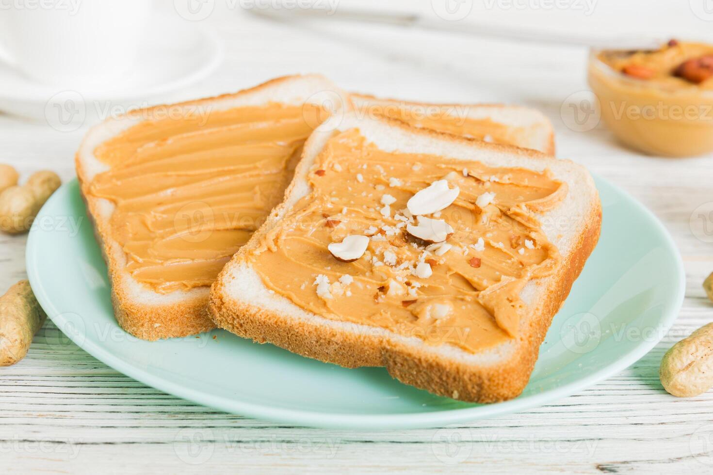 Peanut butter sandwiches toasts light table background. Breakfast. American cuisine photo