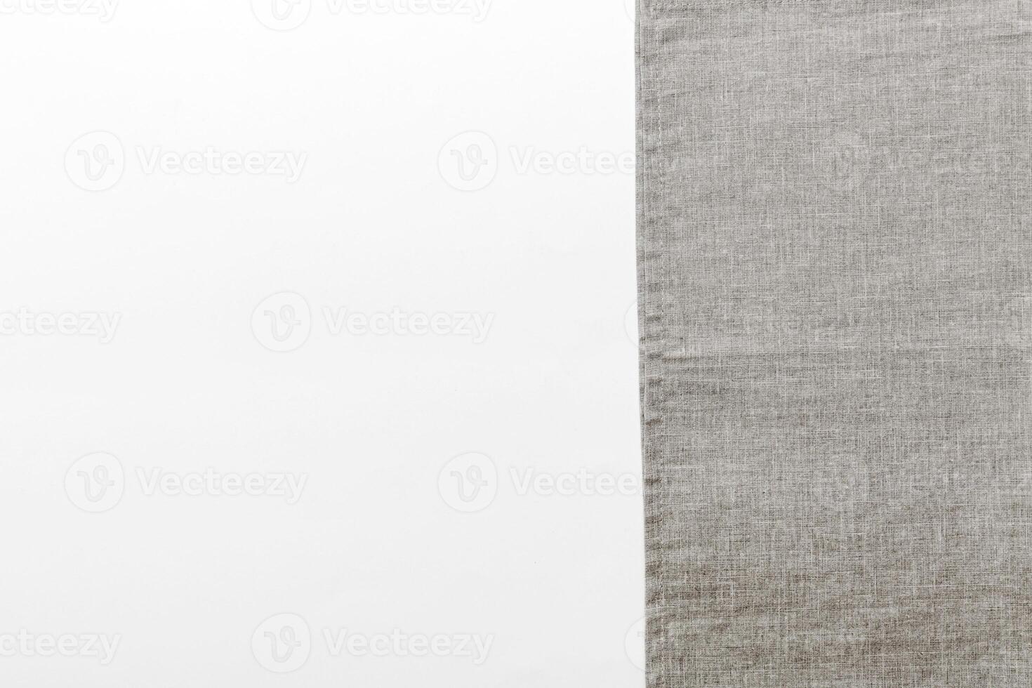 top view gray kitchen napkin isolated on table background. Folded cloth for mockup with copy space, photo