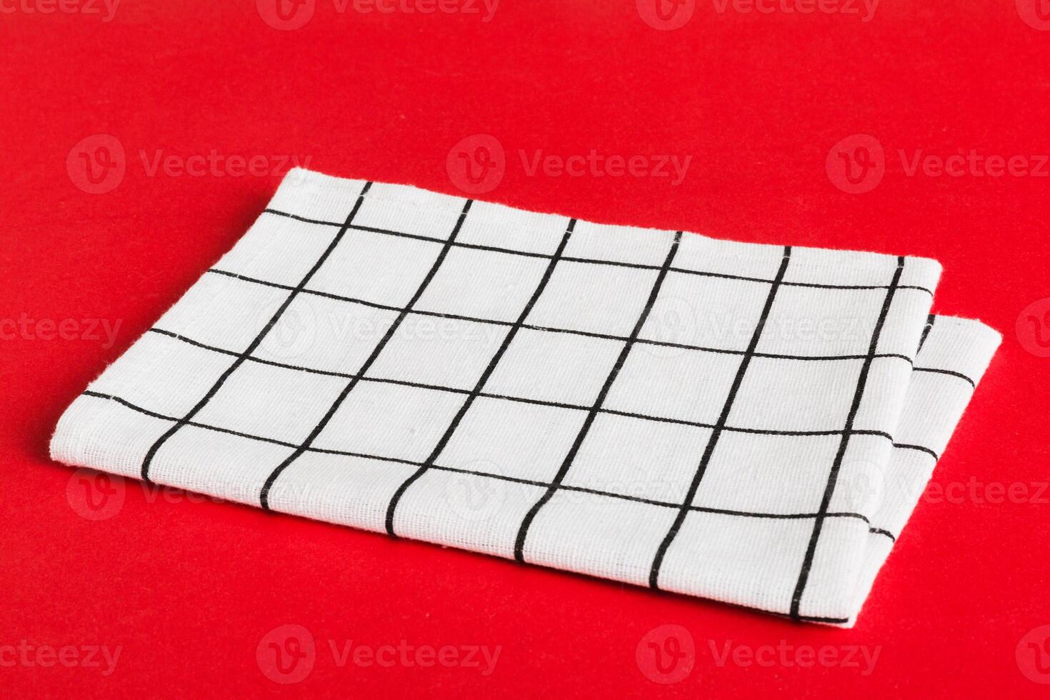 top view white empty kitchen napkin isolated on table background. Folded cloth mockup with copy space, photo