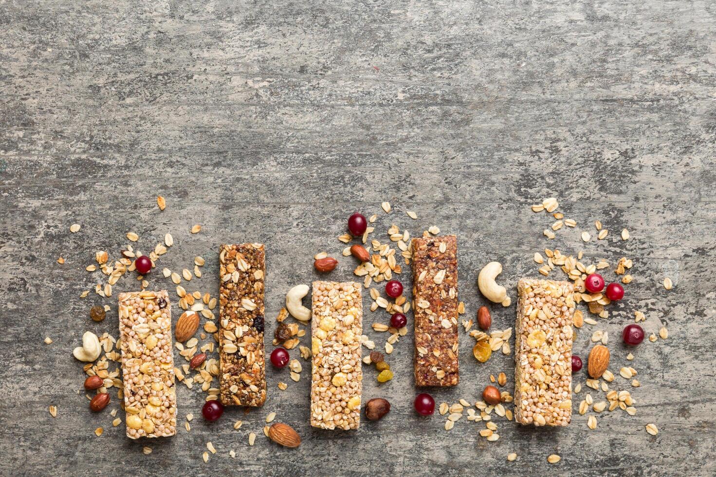 Various granola bars table background. Cereal granola bars. Superfood breakfast bars with oats photo