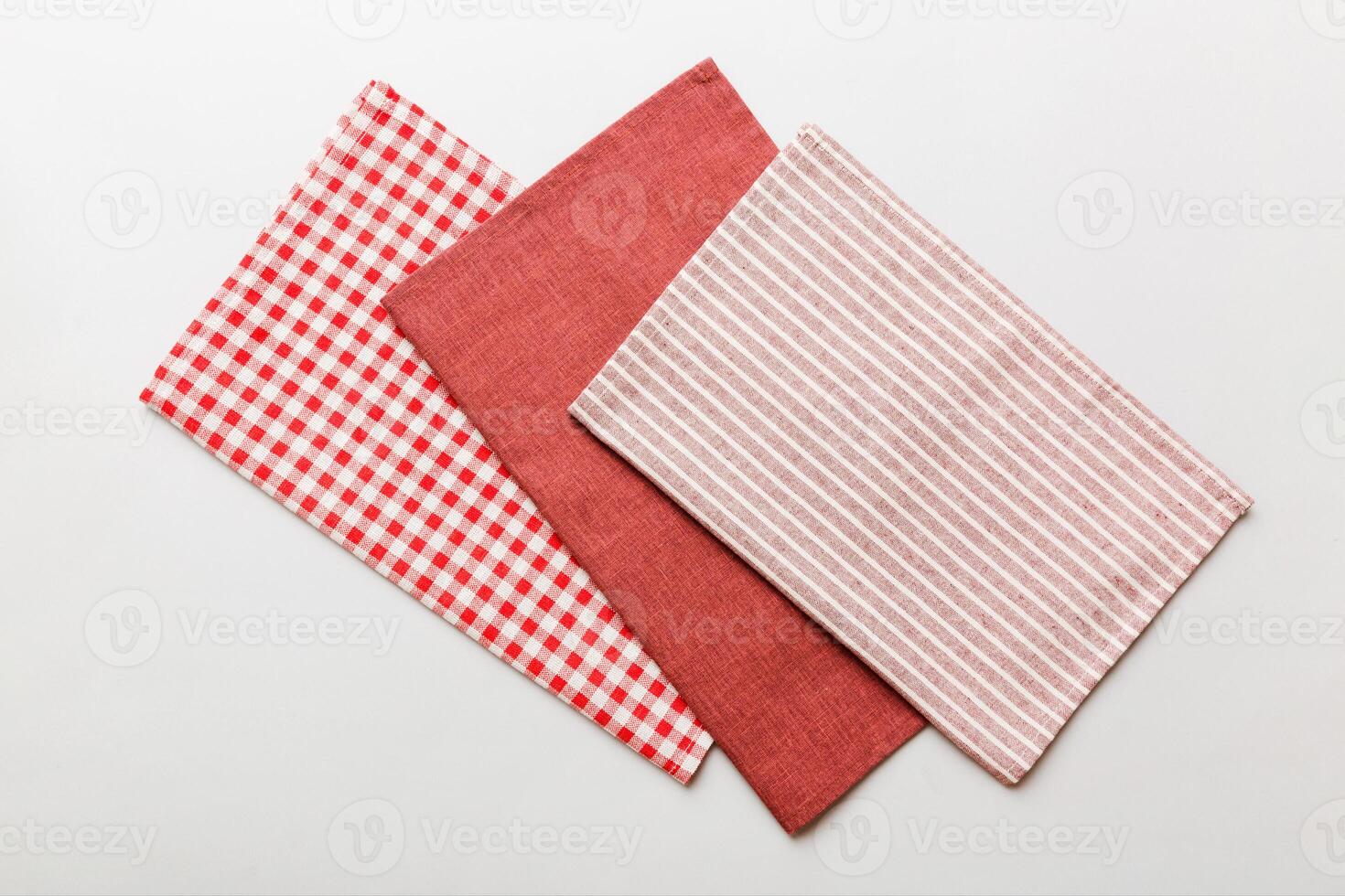 top view red empty kitchen napkin isolated table background. Folded cloth for mockup photo