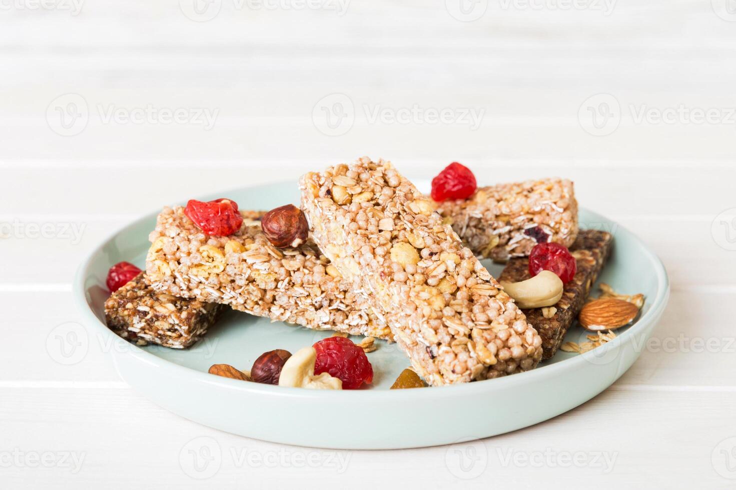 Various granola bars table background. Cereal granola bars. Superfood breakfast bars with oats, nuts and berries. photo