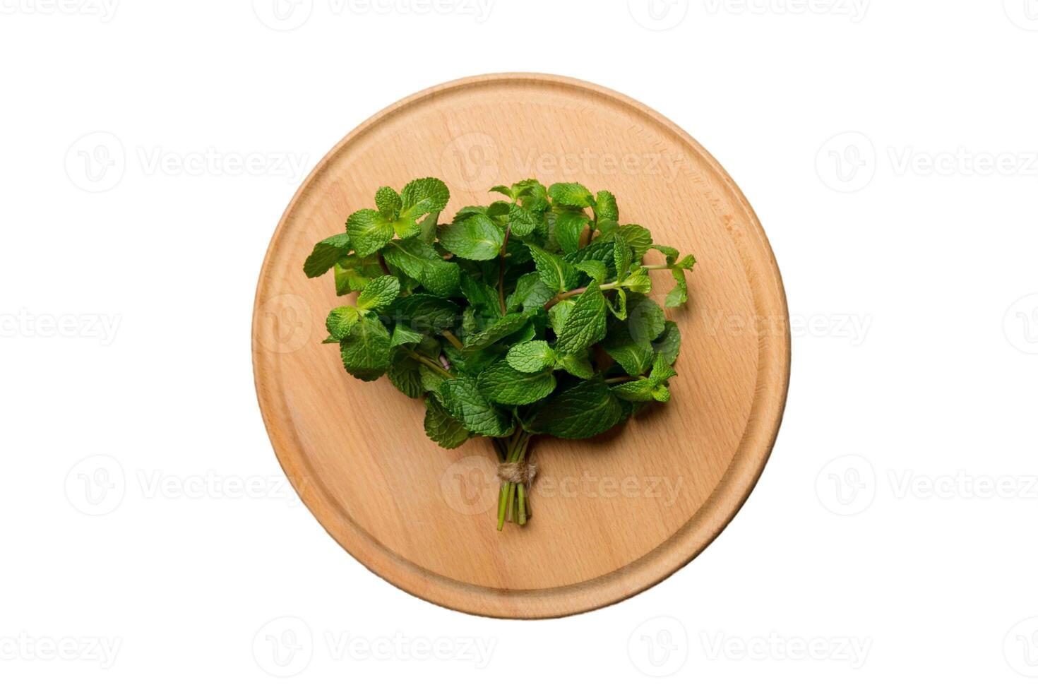 Fresh mint on Cutting board table isolated on white background, top view. Flat lay Space for text photo
