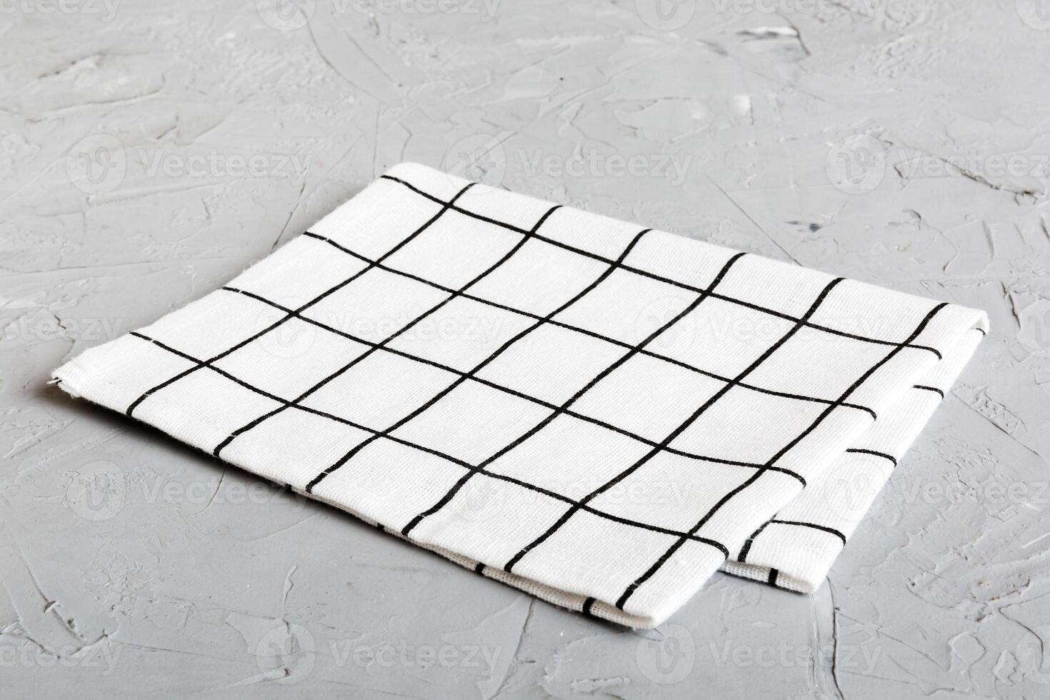 top view white empty kitchen napkin isolated on table background. Folded cloth mockup with copy space photo