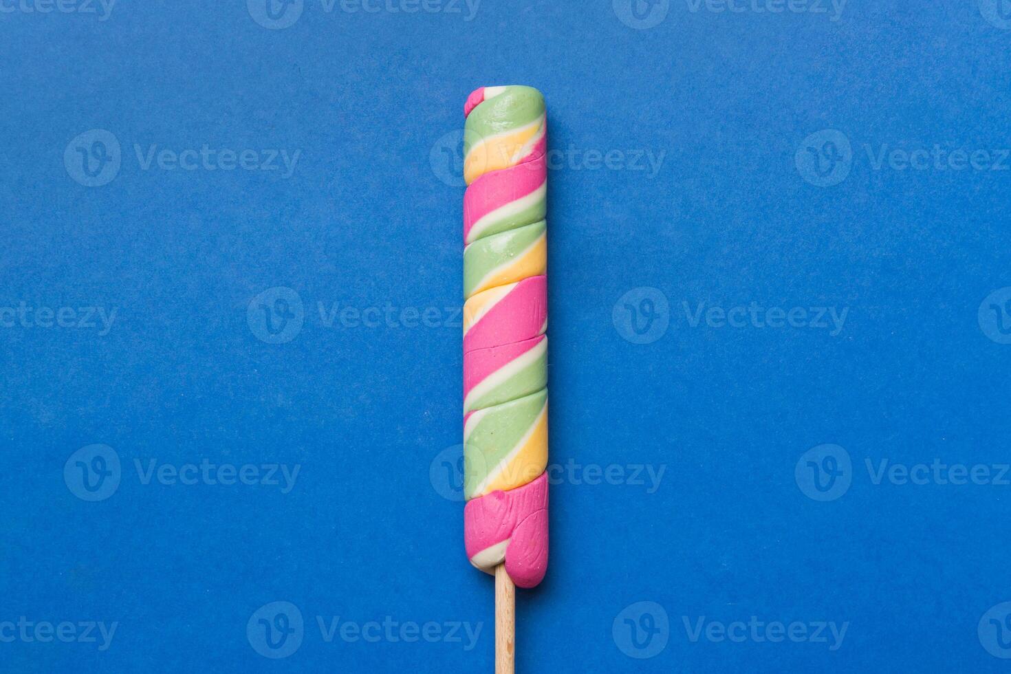 Colorful candies, lollypop the colorful background, colored minimal style top view photo