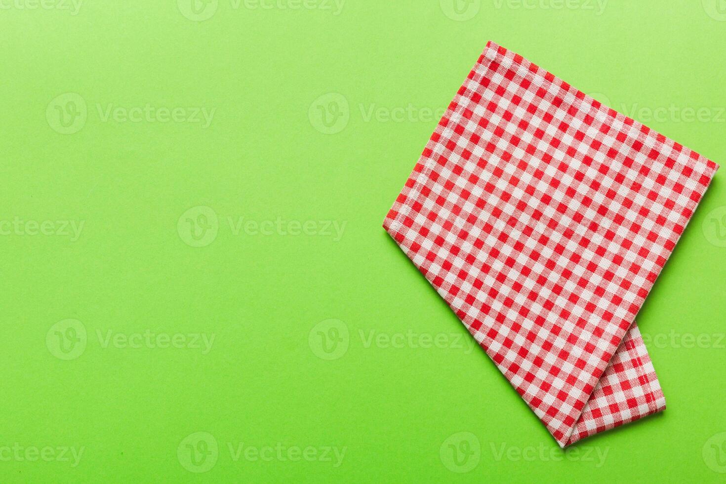 top view with red empty kitchen napkin isolated on table . Folded cloth for mockup photo