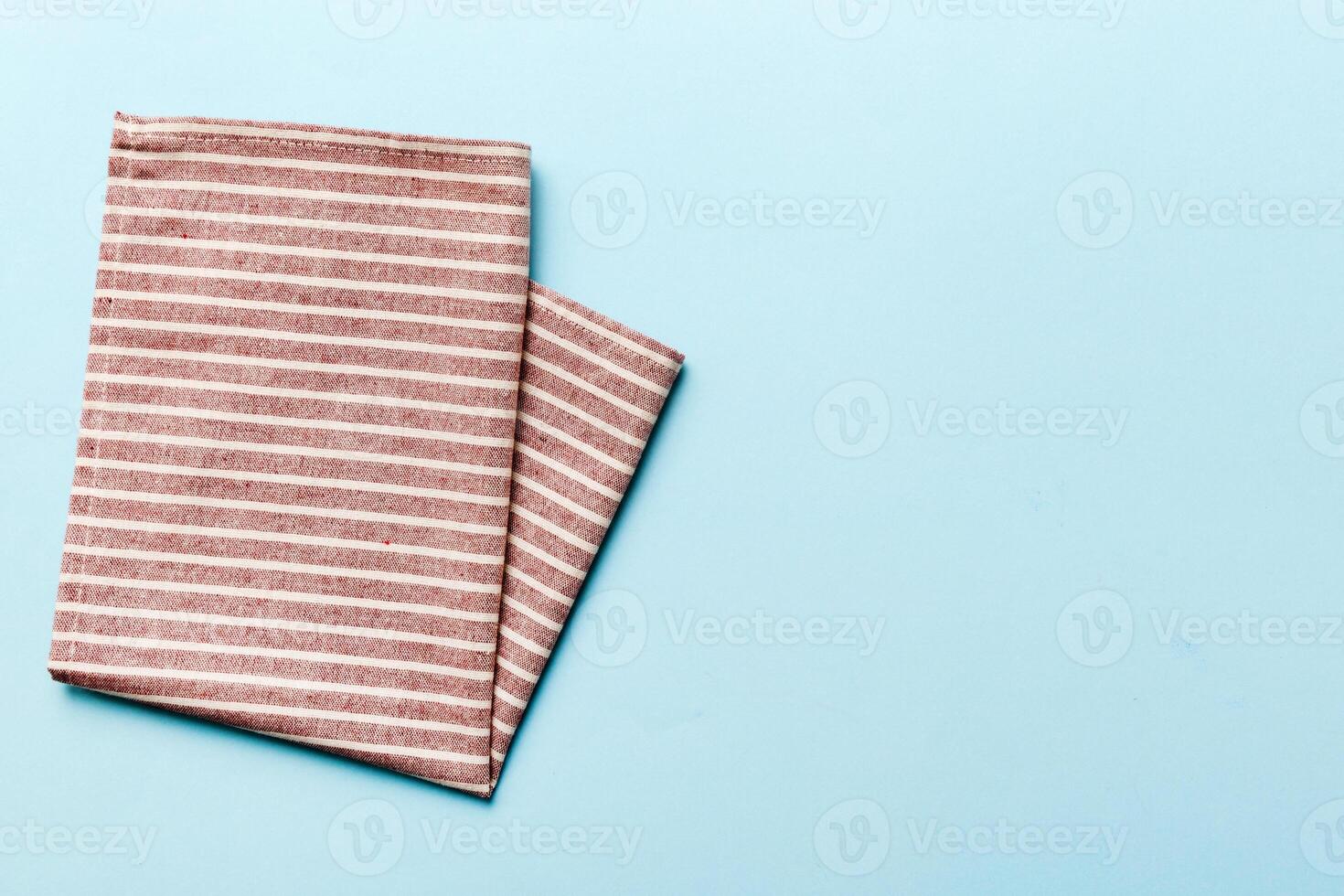 top view red empty napkin isolated on table background. Folded cloth for mockup photo