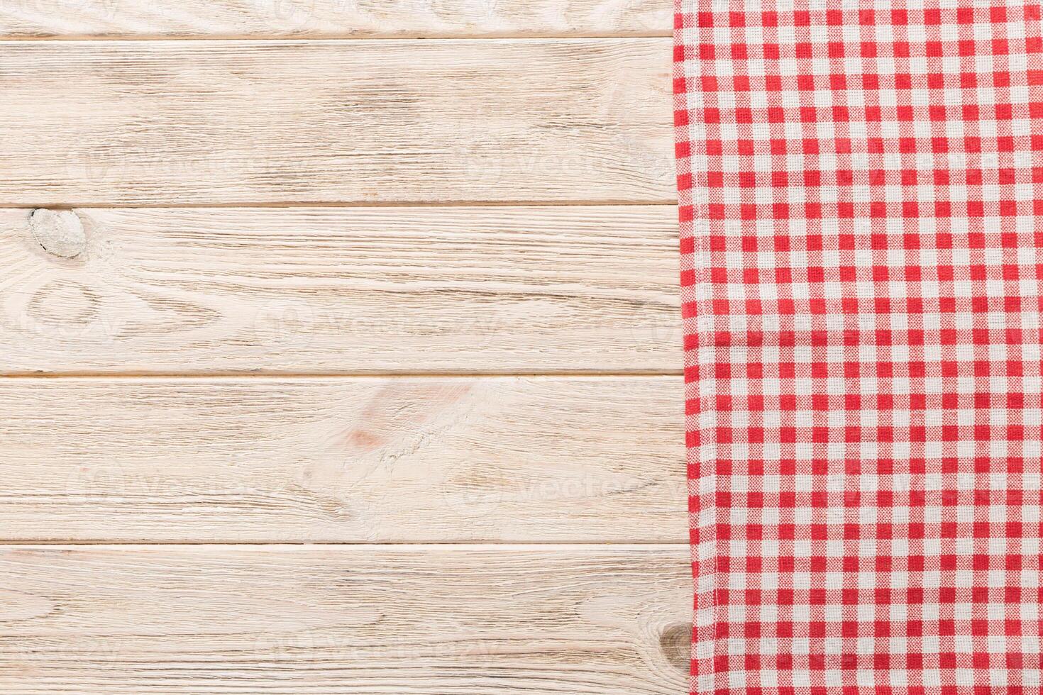 top view with red empty kitchen napkin isolated on table background. Folded cloth photo