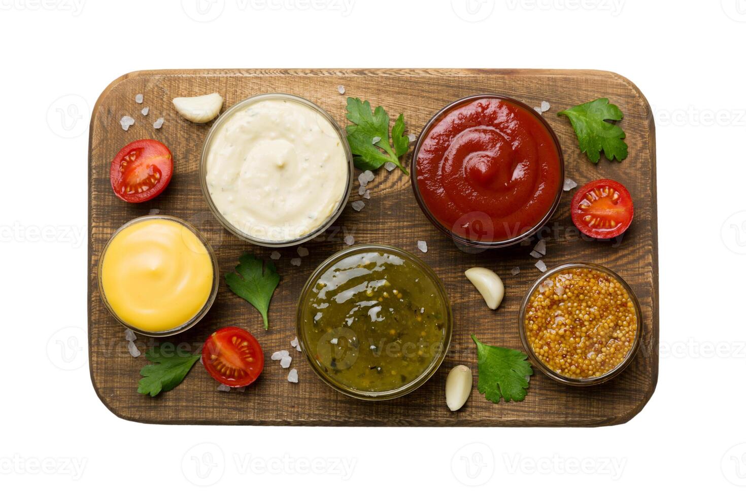 Many different sauces and herbs isolated on white background, flat lay top view. sauces on plate photo