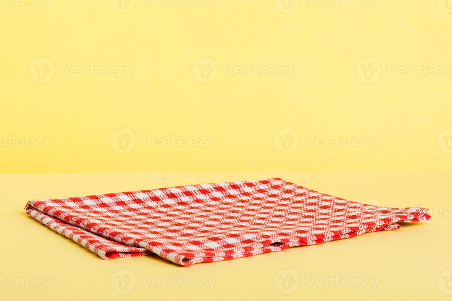 top view red empty kitchen napkin isolated on table background. Folded cloth for mockup with copy space. Minimal style photo