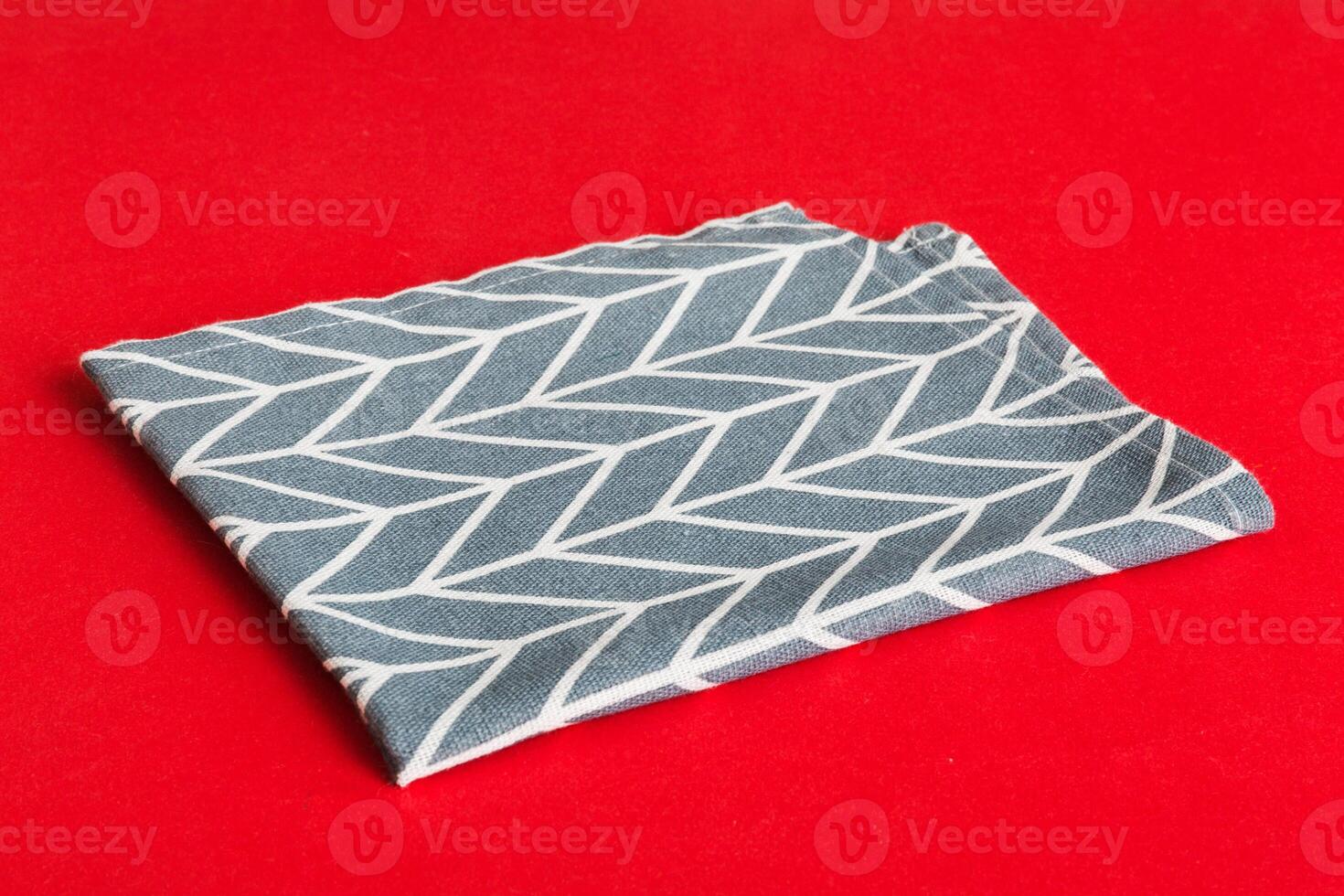 top view blue kitchen napkin isolated on table background. Folded cloth for mockup with copy space, Minimal style photo