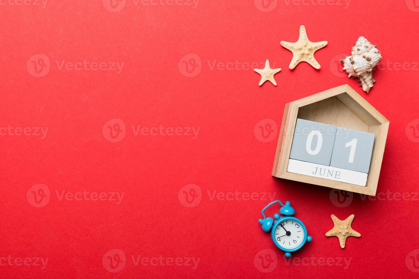 Image of june 1 wooden calendar on colored background. Summer day. Empty space photo