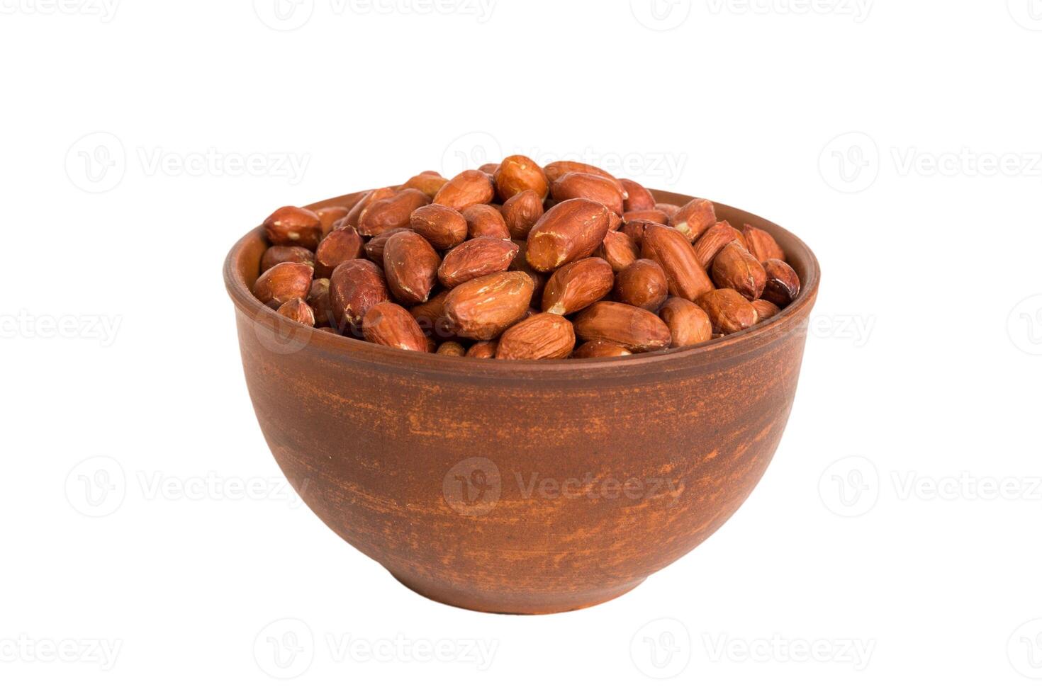 Roasted almonds in bowl isolated on white background. almonds is snack or raw cook. Healthy food concept photo