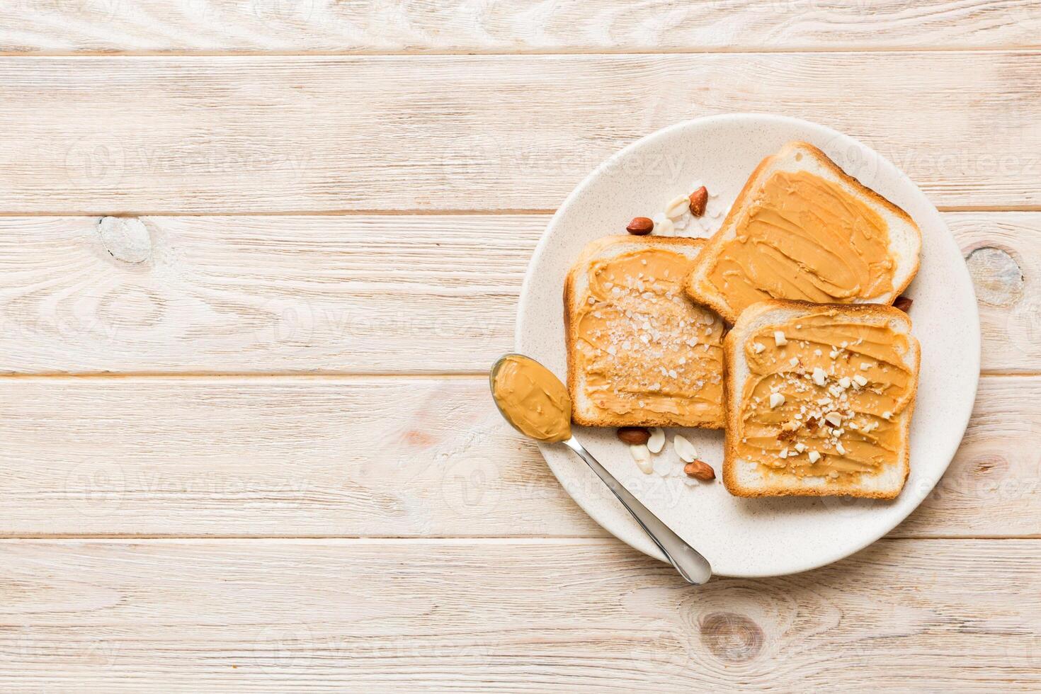 Peanut butter sandwiches toasts light table background.Breakfast. Vegetarian food photo