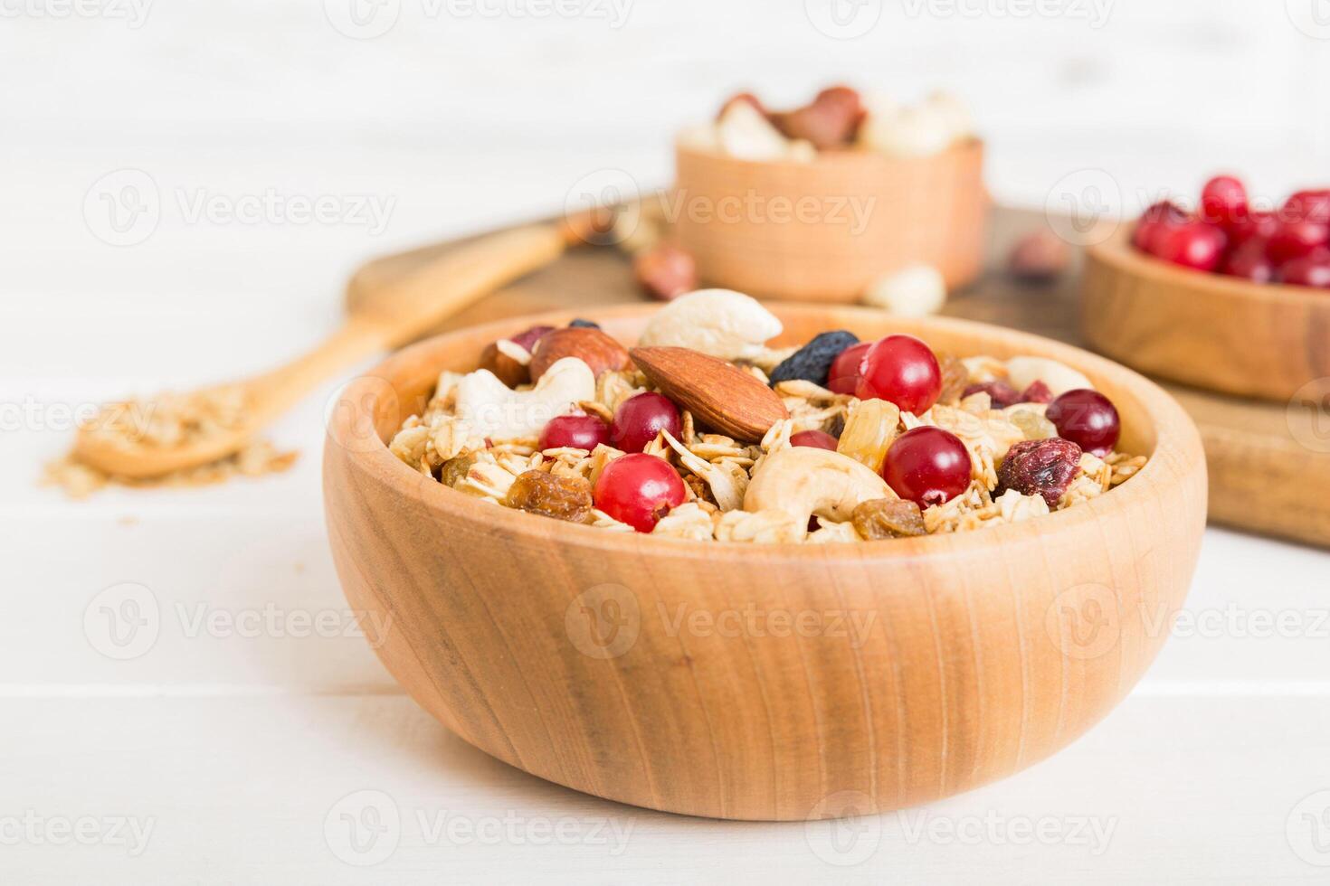 Cooking wholesome breakfast. Granola with Various dried fruits and nuts in a bowl. The concept of healthy dessert. top view photo