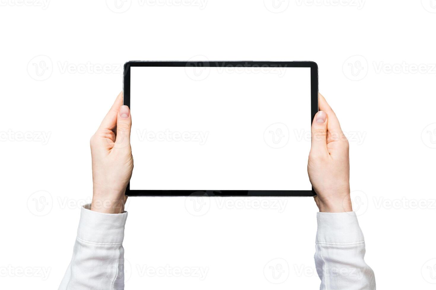 Close up image woman hands holding digital tablet with blank copy space screen for your text message or promotional content om table with cup of coffee. hands of woman holding blank tablet device photo