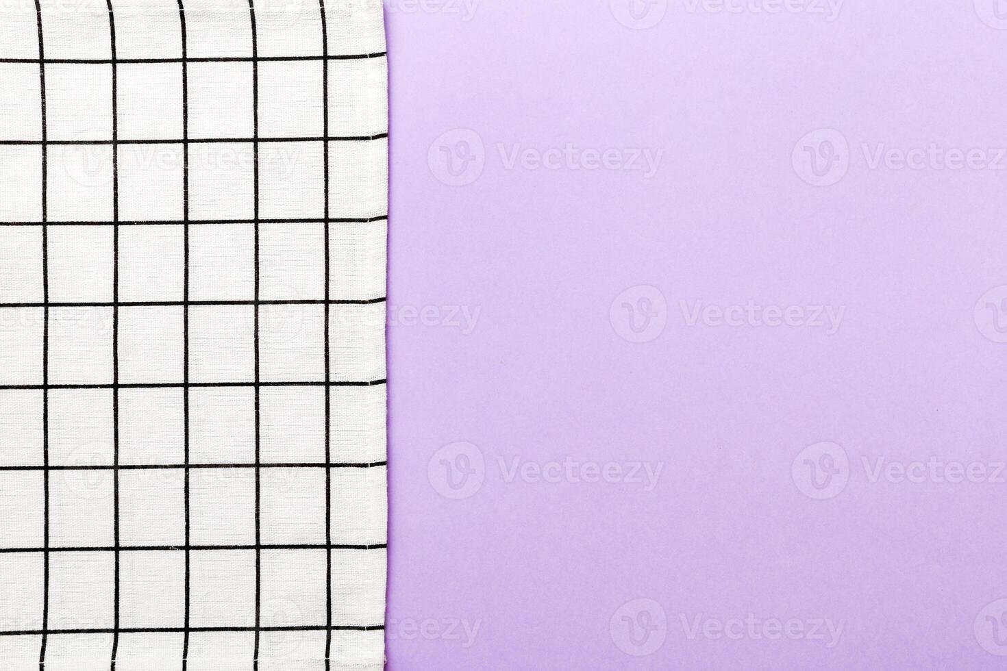 top view with white empty kitchen napkin isolated on table. Folded cloth for mockup photo