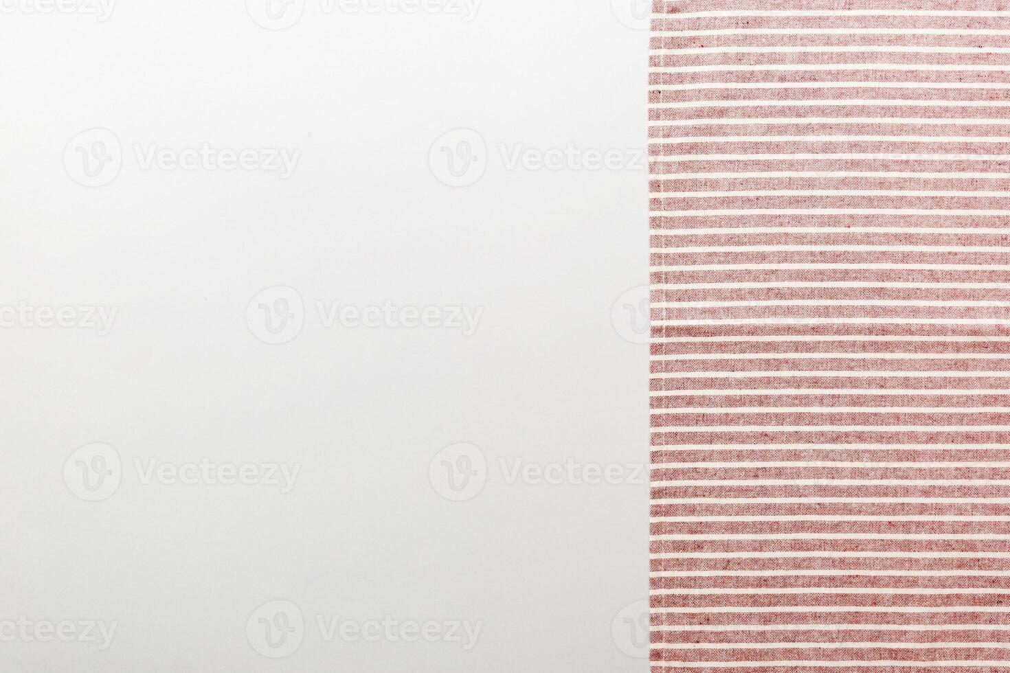 top view with red empty kitchen napkin isolated on table background. Folded cloth for mockup with copy space. photo