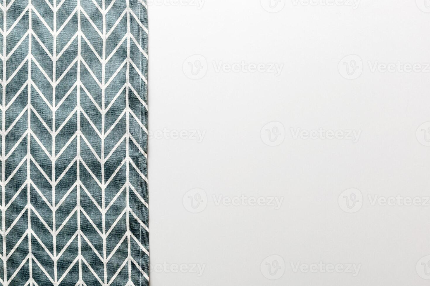top view blue kitchen napkin isolated table background. Folded cloth for mockup with copy space photo