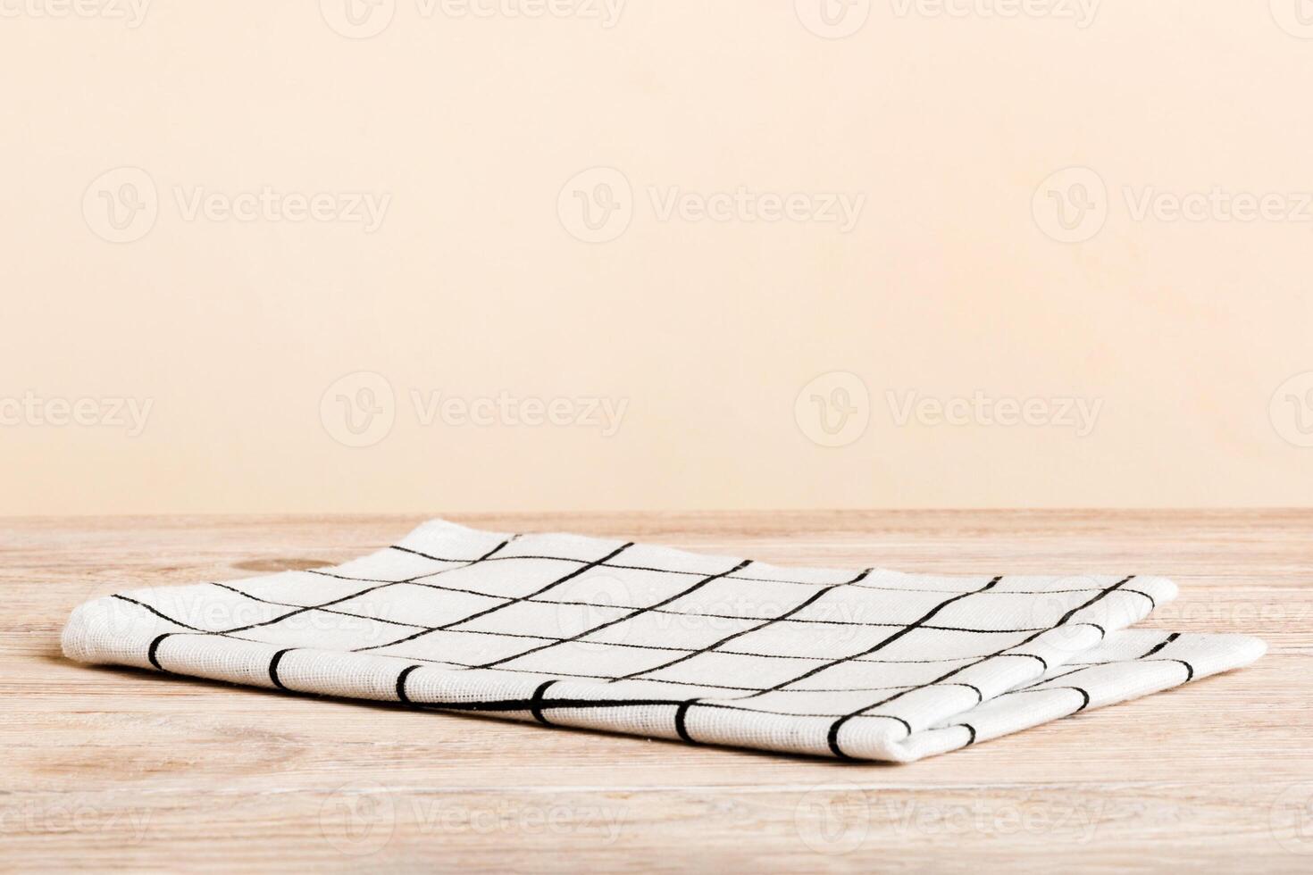 top view with white empty kitchen napkin isolated on table background. Folded cloth for mockup photo