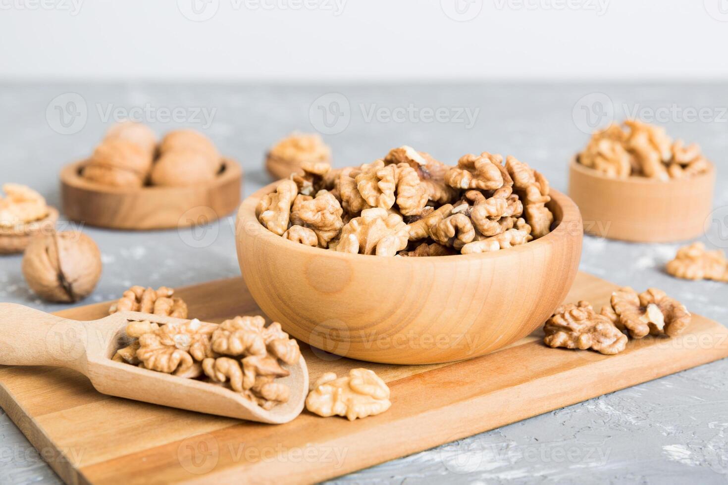 Fresh healthy walnuts in bowl on table background. Top view Healthy eating bertholletia concept. Super foods photo