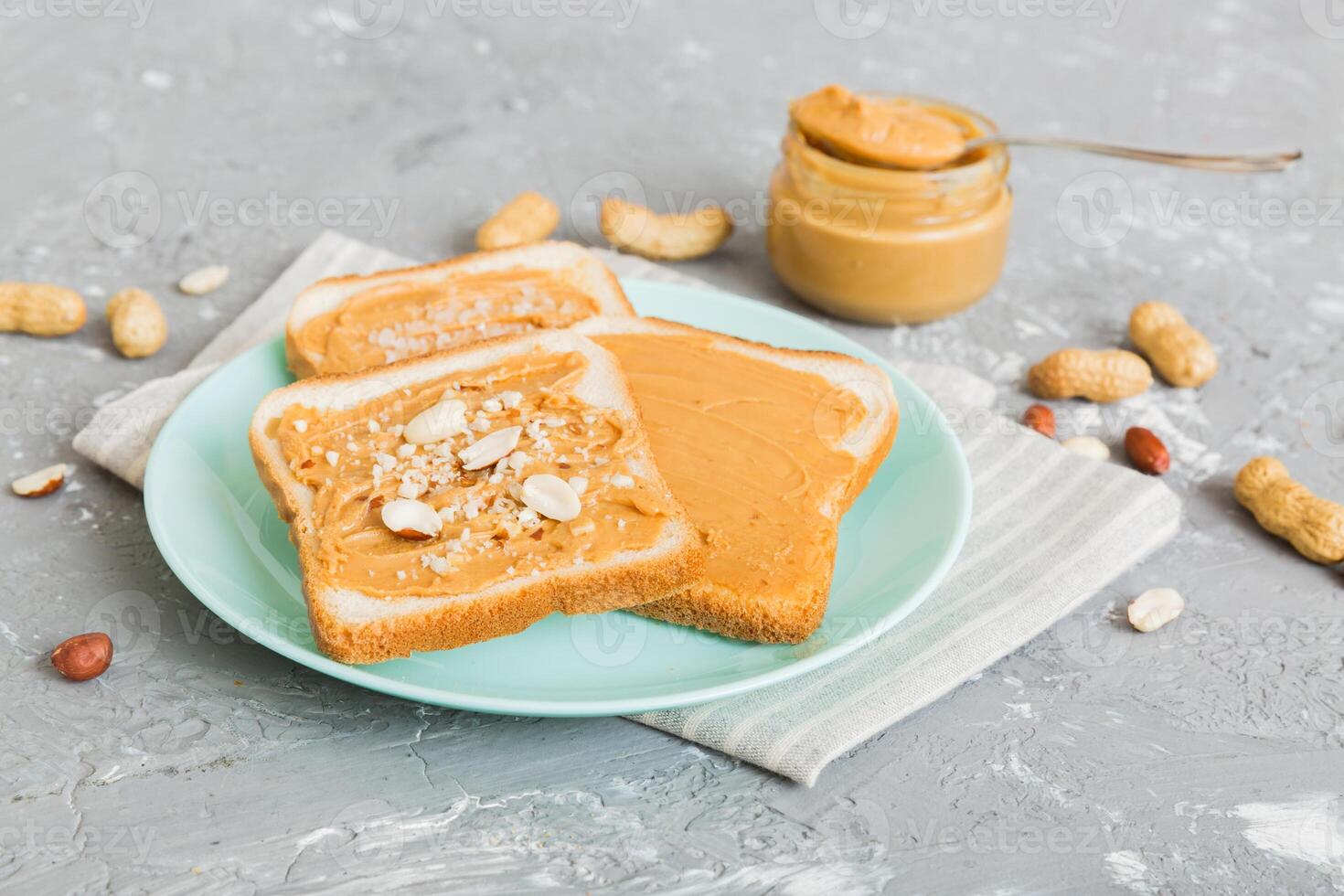 Peanut butter sandwiches toasts light table background.Breakfast. American cuisine photo
