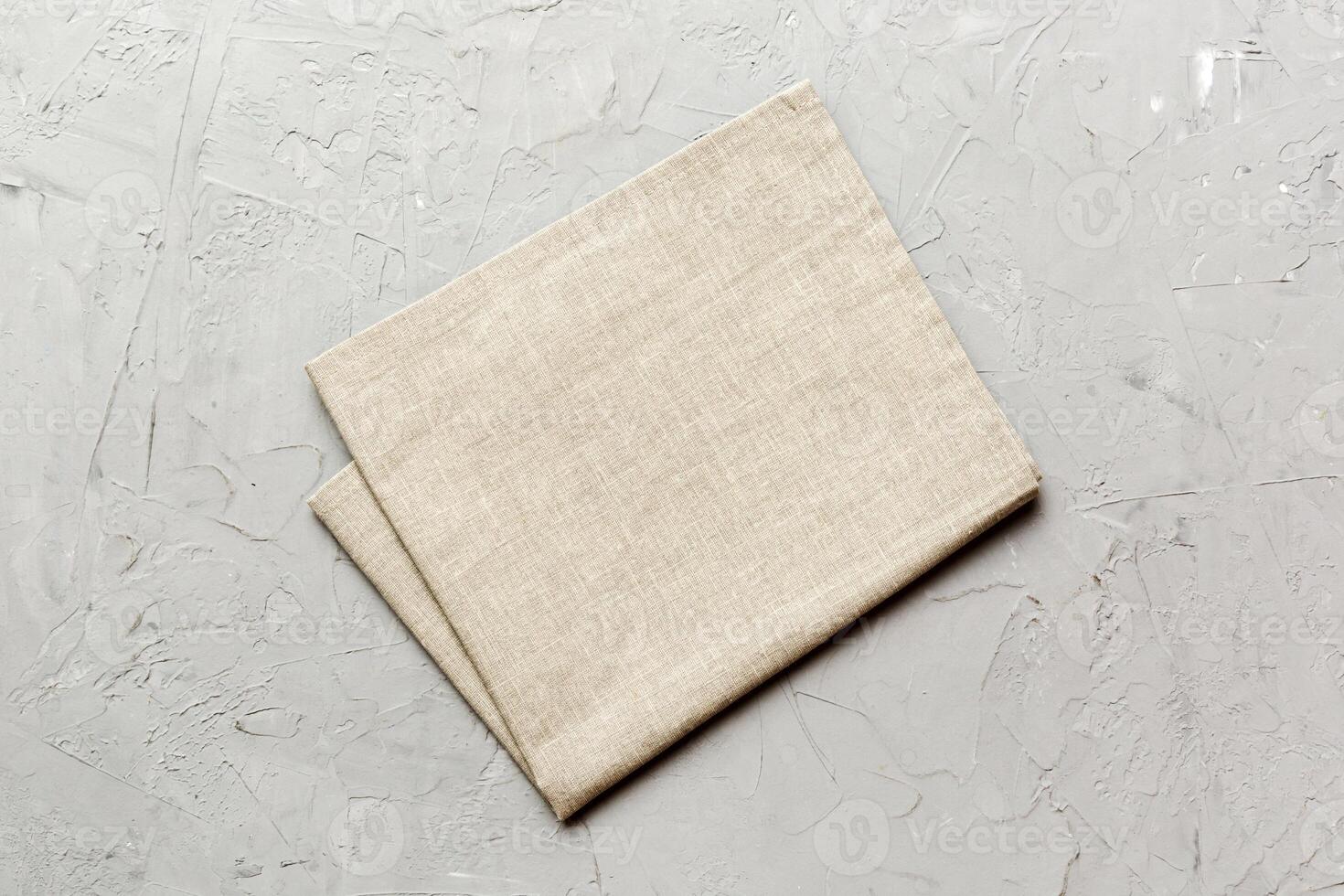top view with gray kitchen napkin isolated table background. Folded cloth for mockup with copy space. Minimal style photo