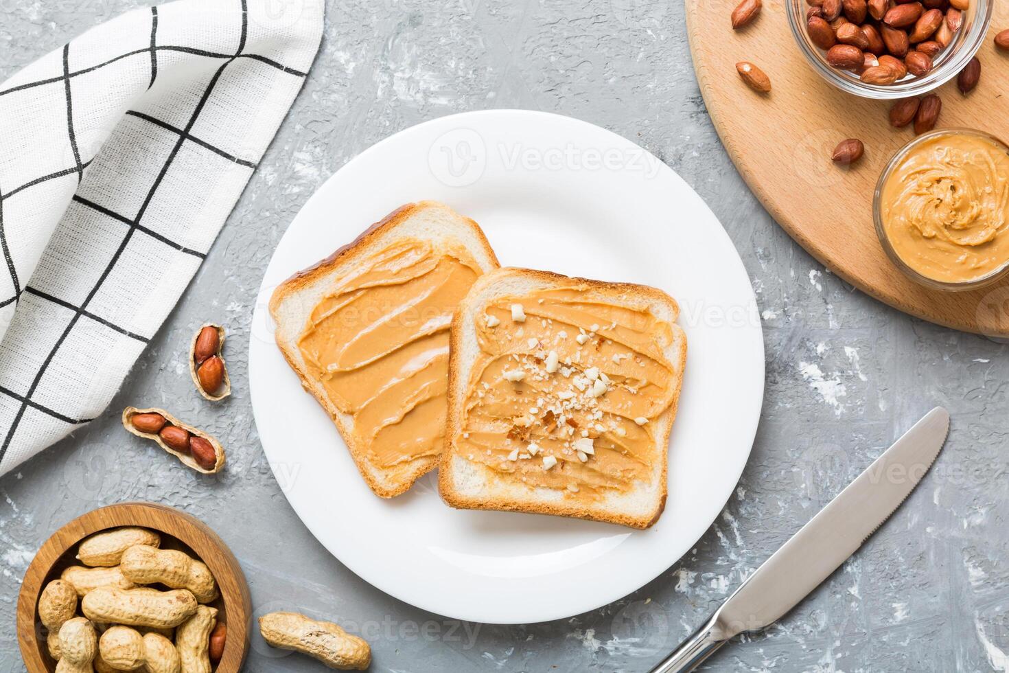 Peanut butter sandwiches toasts light table background. American cuisine top view photo