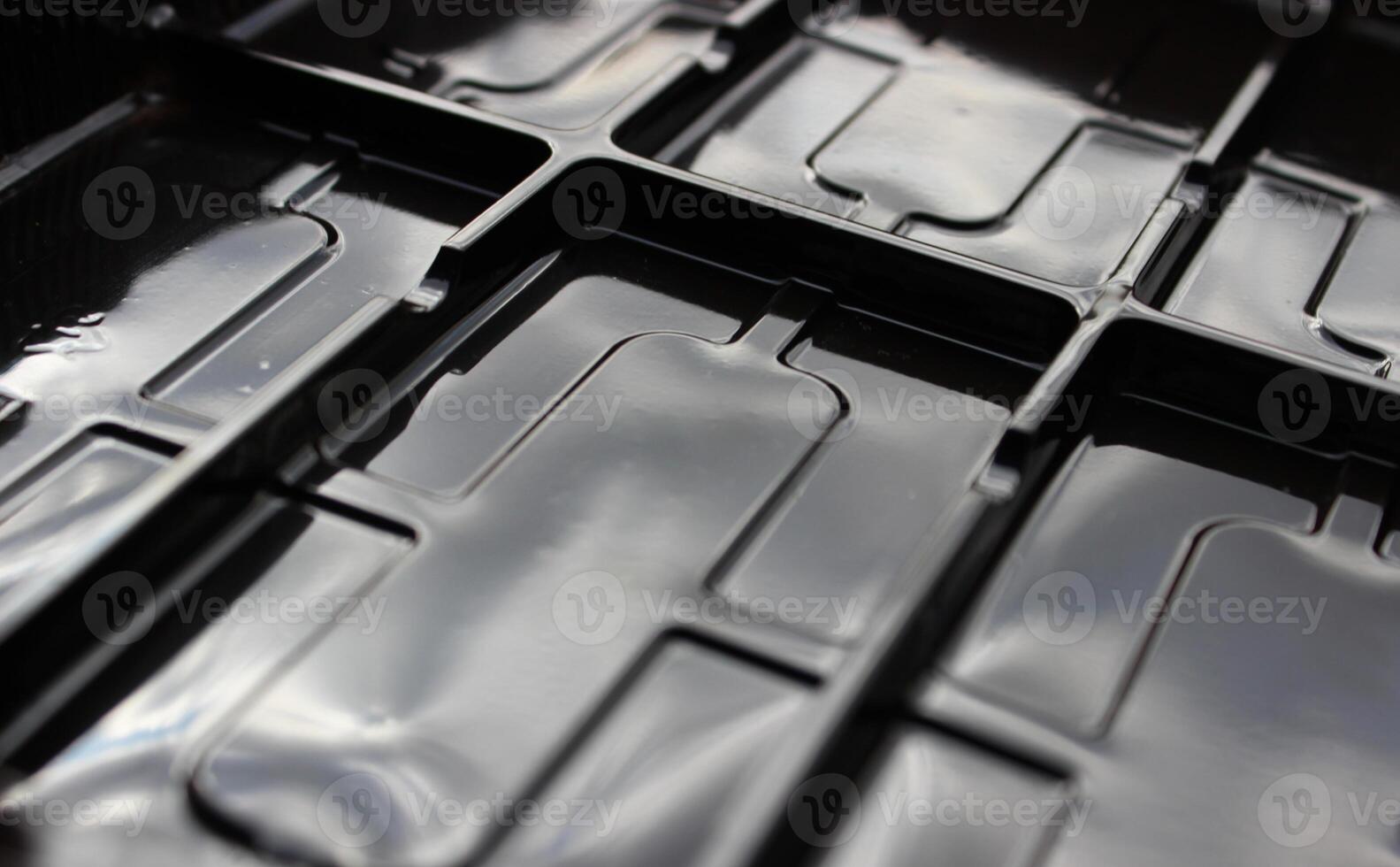 Glossy plastic surface with rectangular compartments photo