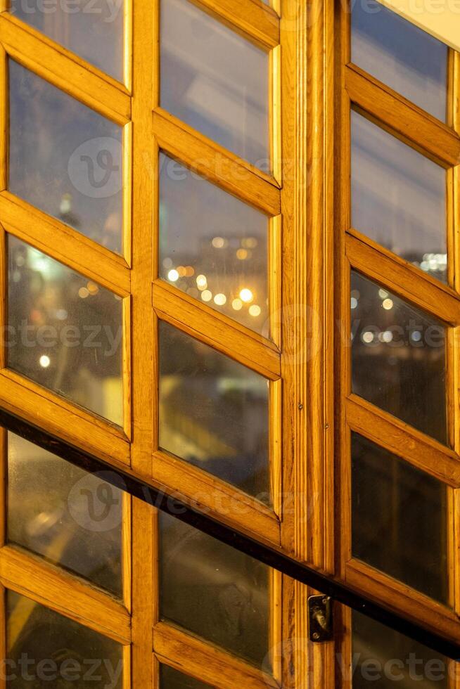 window made of wooden planks and glass inserts photo