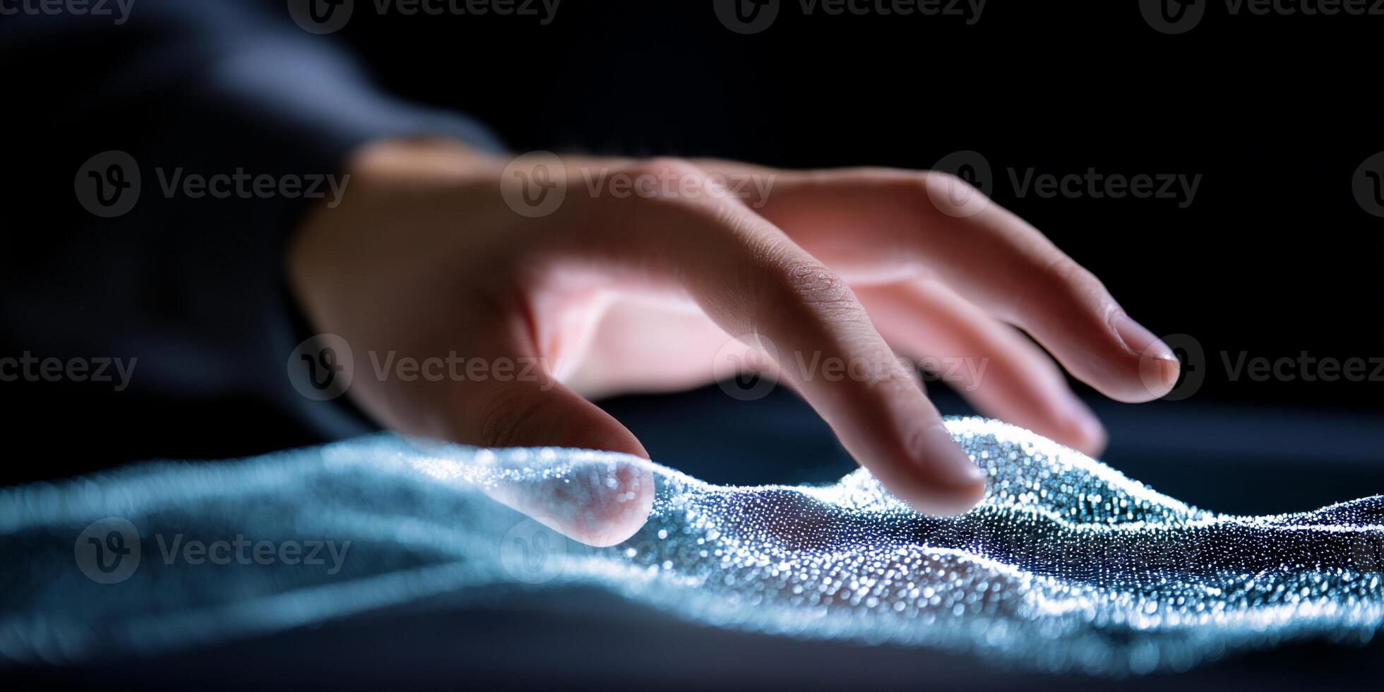 A person touching a screen with a wave pattern photo