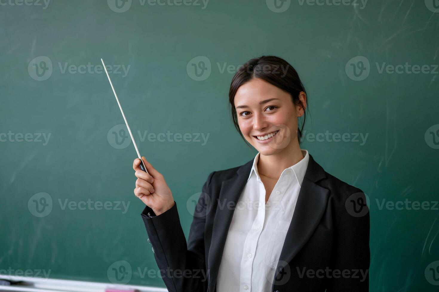 Teacher pointing with pointer photo