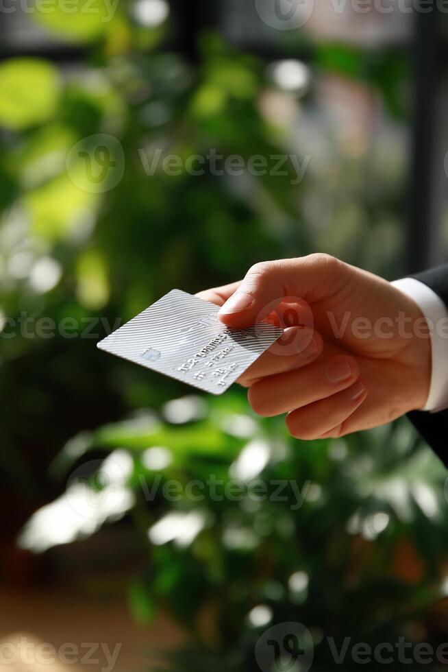 Hand holding a white card photo