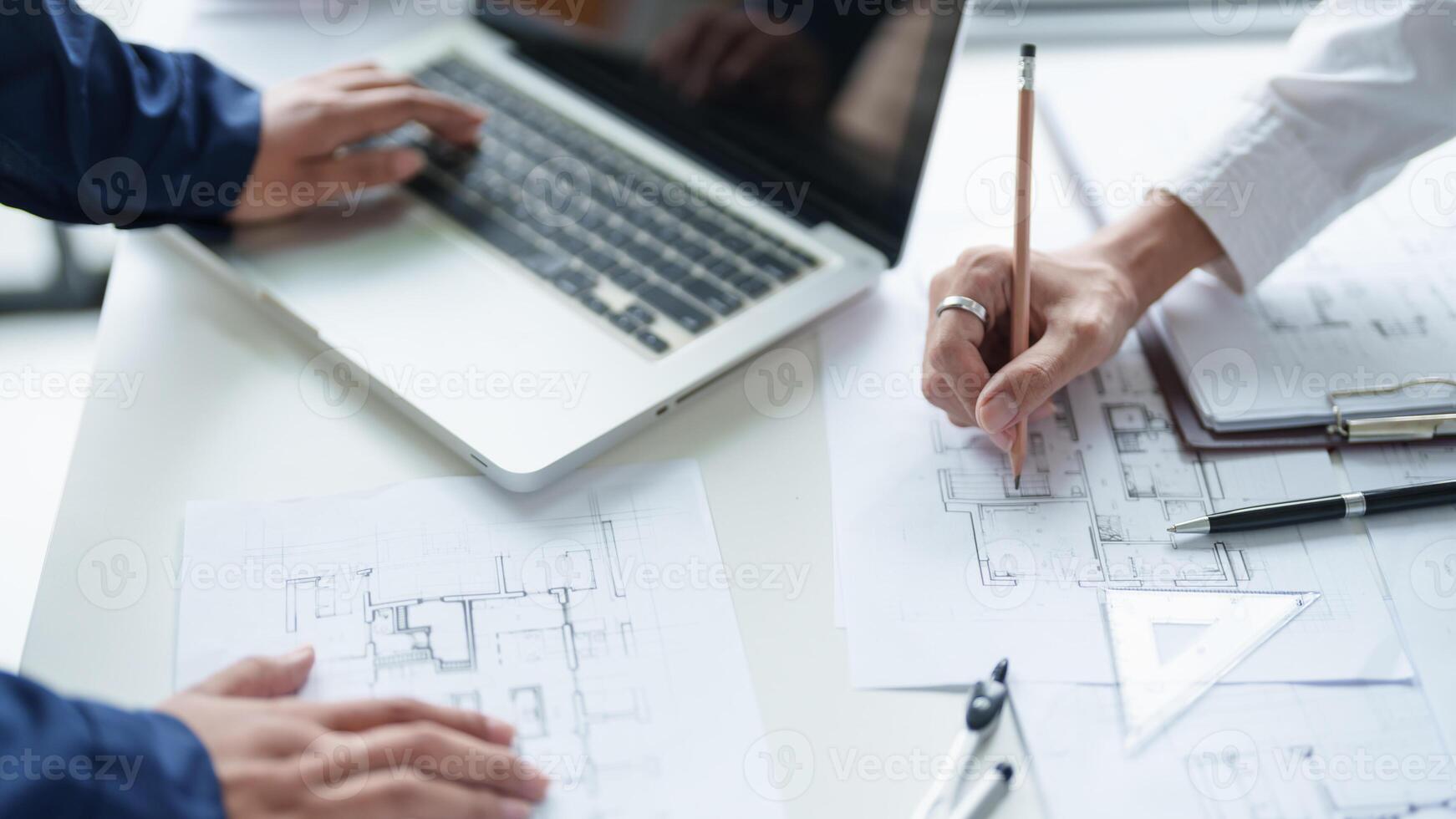 Architecture drawing on project business architecture building construction Colleagues designer Planning Design on blueprint and compasses photo