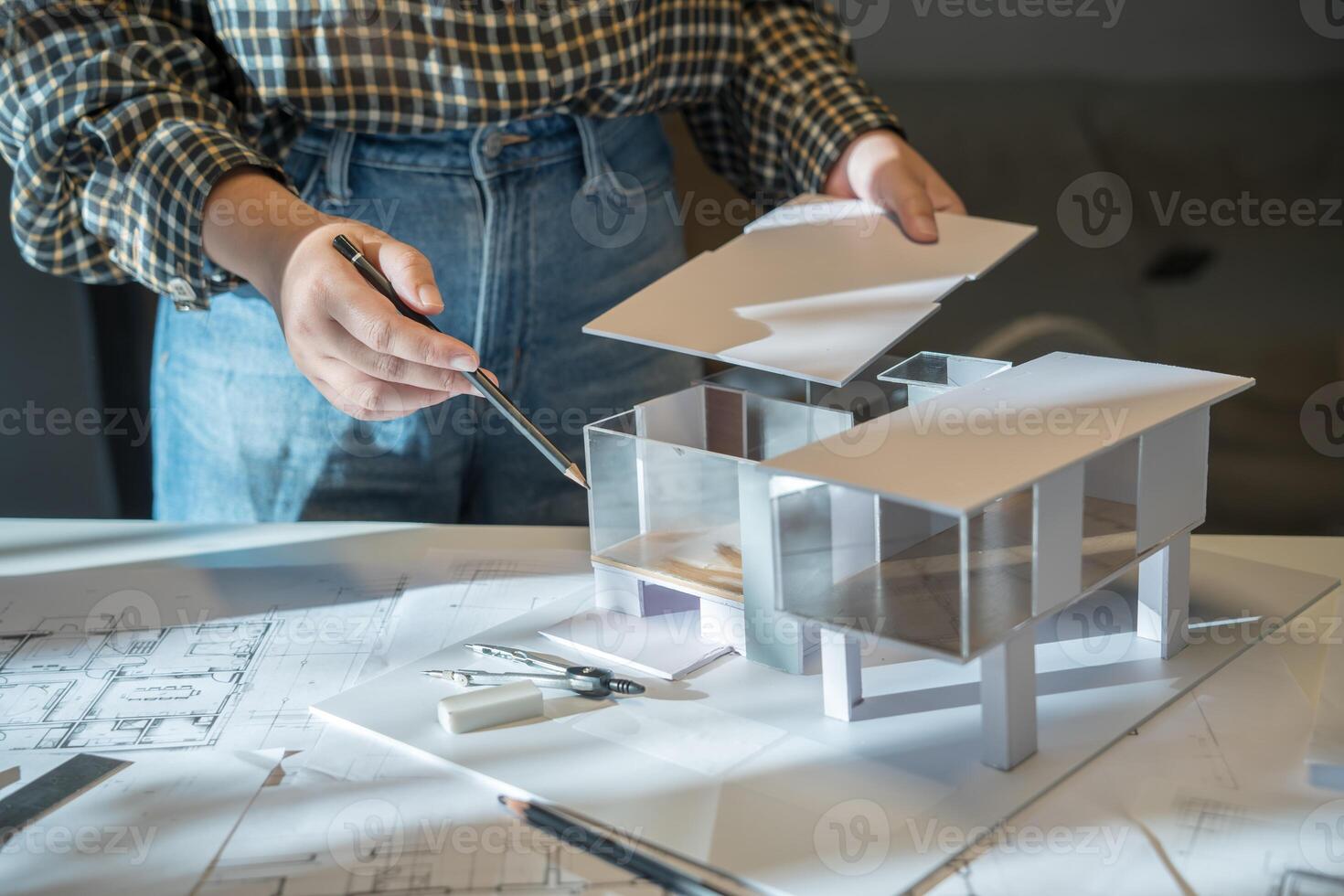 Architect Design working on a model of a house photo