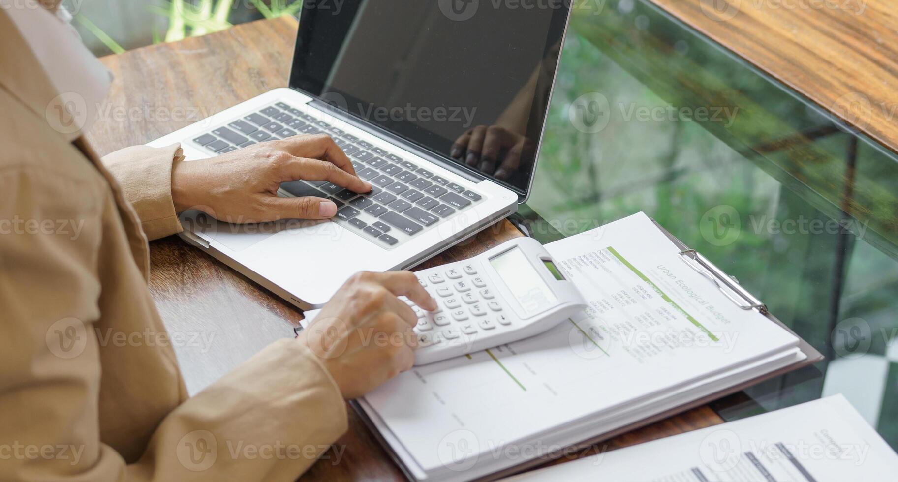 Calculating Cost Economic budget saving and investment concept analyzing investment charts and calculator Accounting Concept. photo