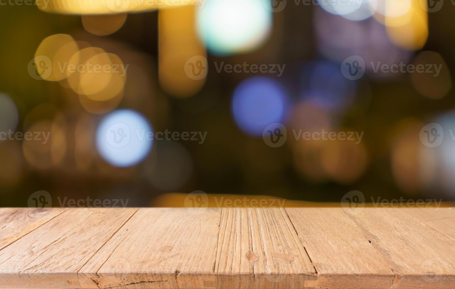 empty wooden table on blurred backgrounds. photo