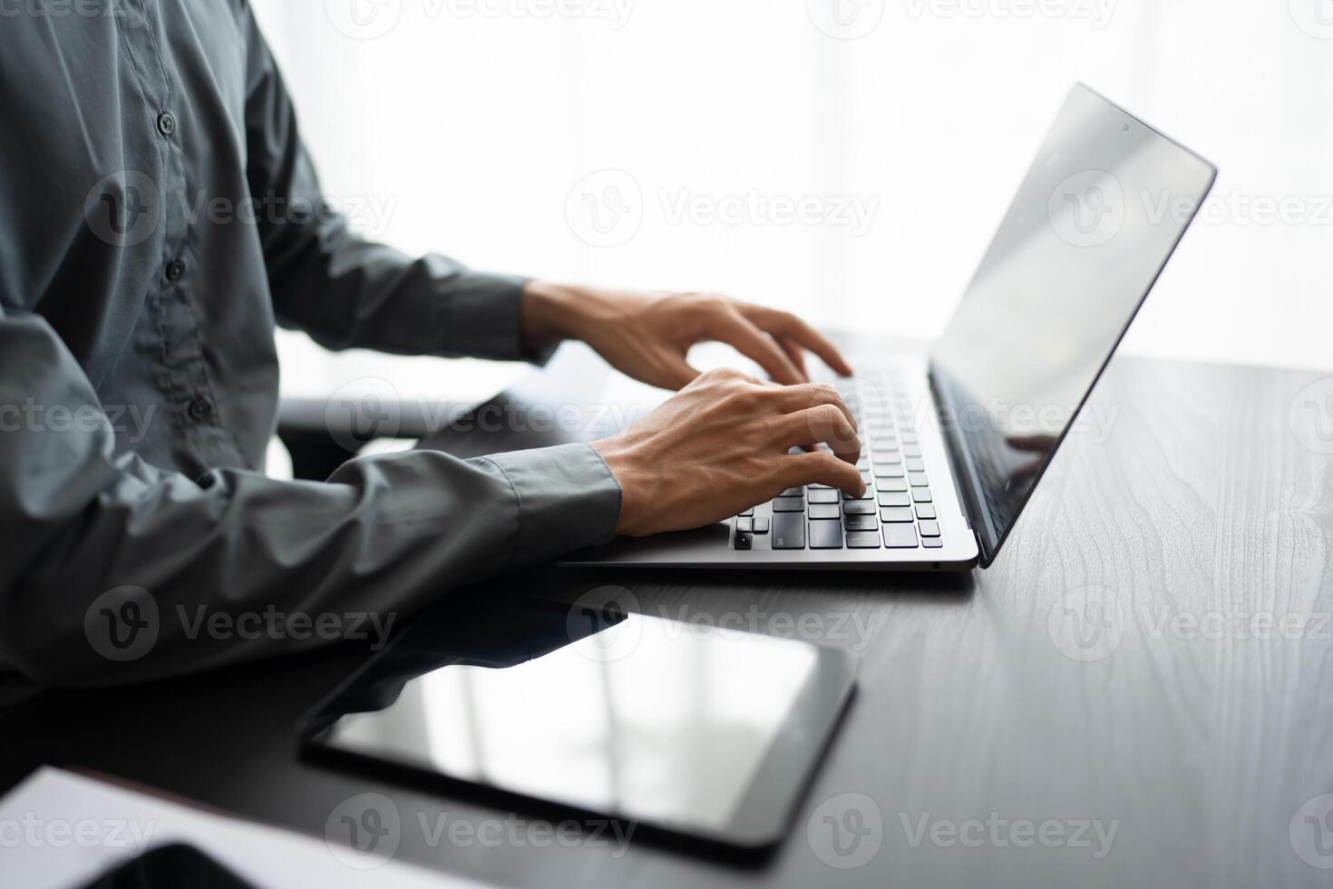 a person typing on a laptop computer coding photo
