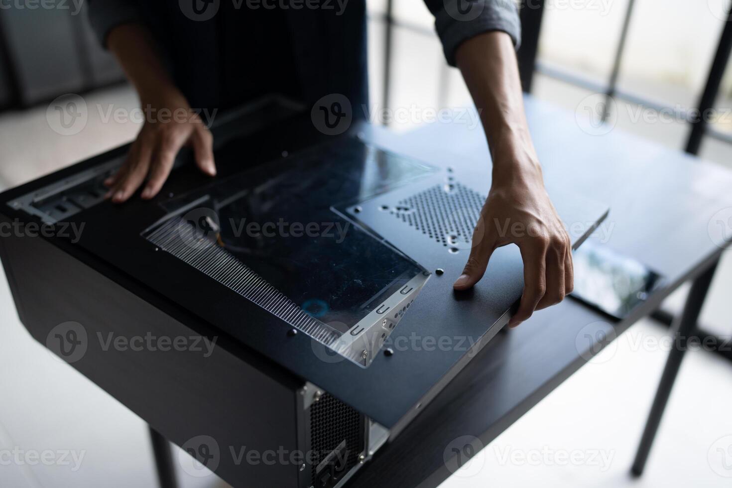 IT Engineer installing Hardware opening a laptop on a table photo