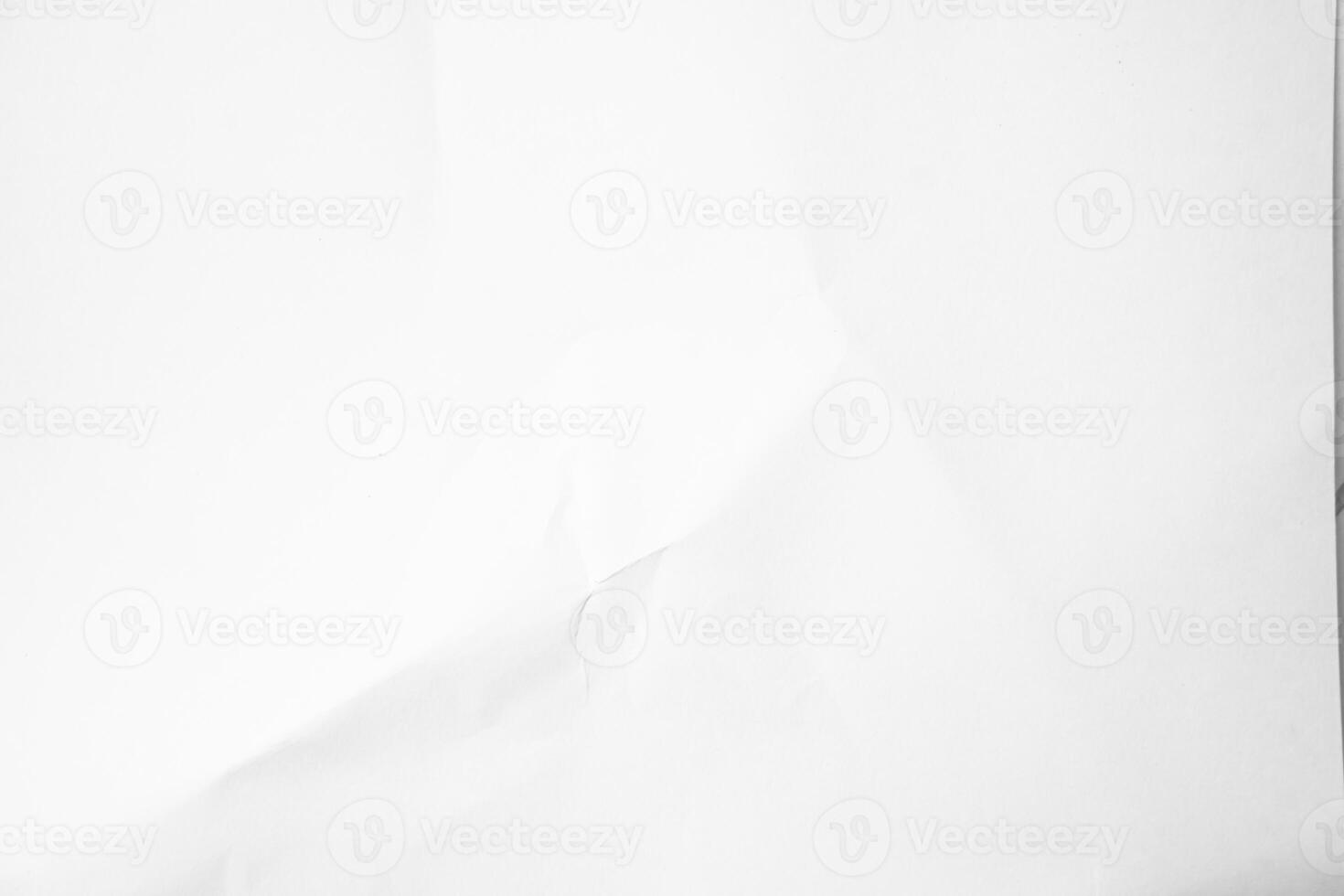 a white sheet of paper with a hole in it photo