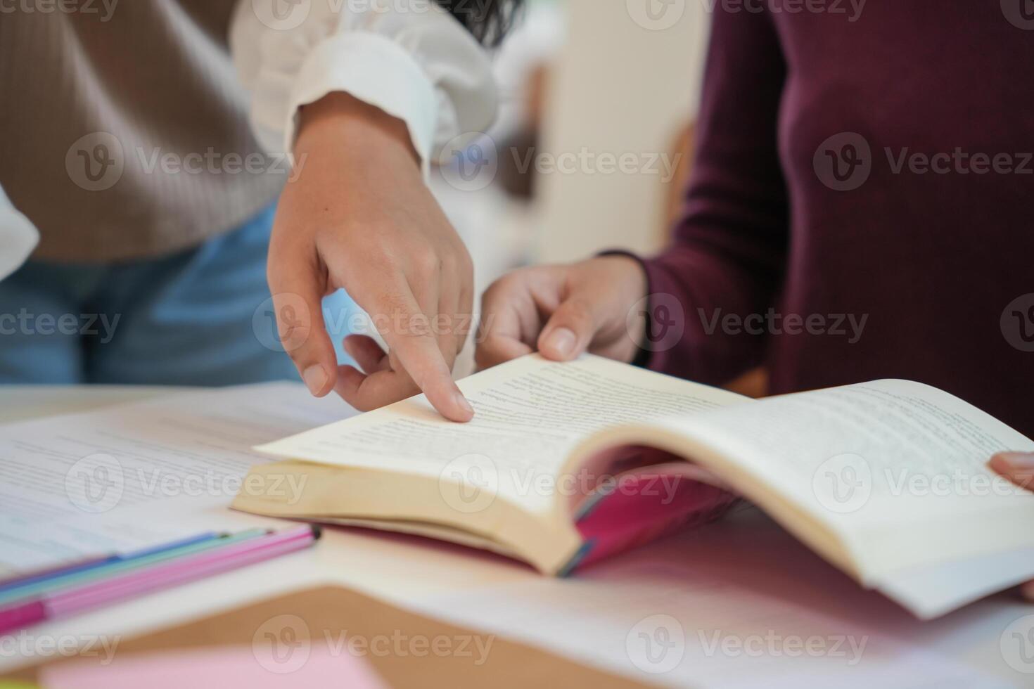 Learning with friends Young students campus High School Tutor for examining helps school homework together with friend catching up and learning photo