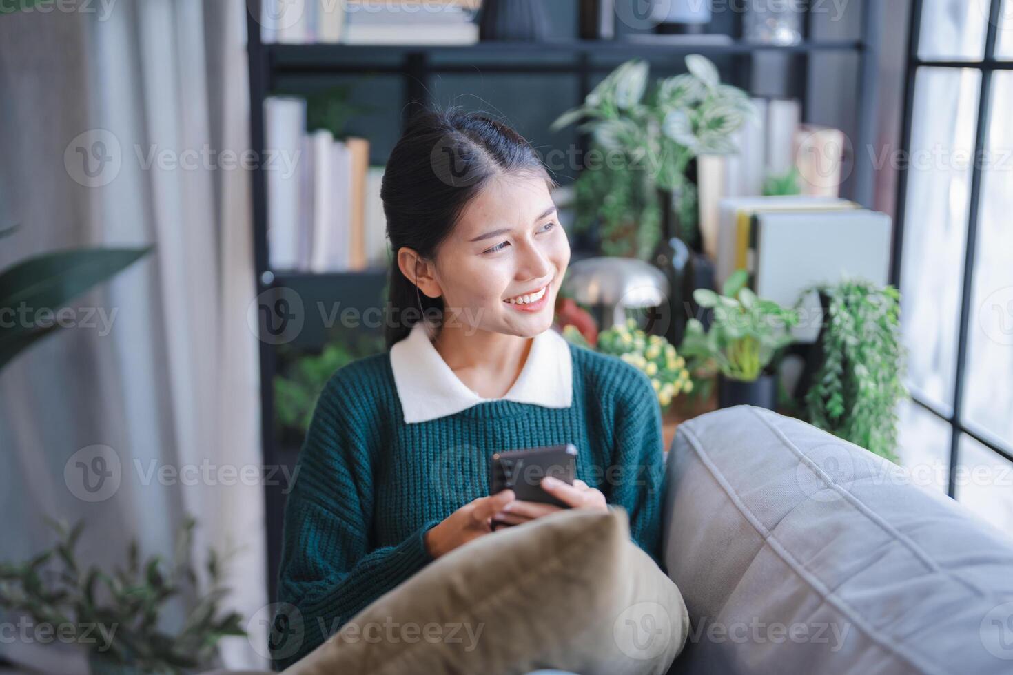 woman user customer hold smart phone Social media addiction with finger rings using online app on mobile phone browsing Internet chatting on social media photo
