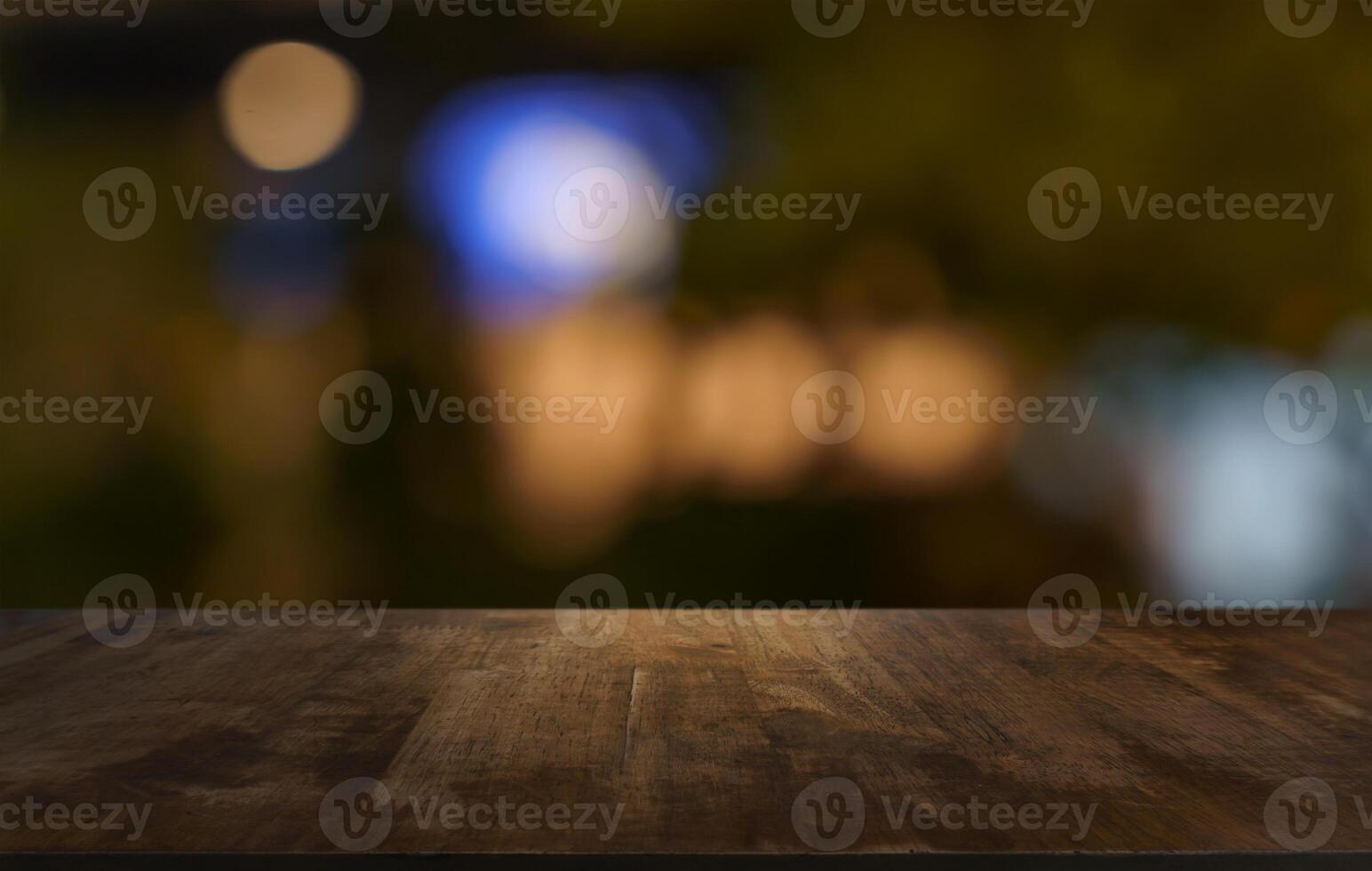wood table and blur of restaurant background focus product display. photo