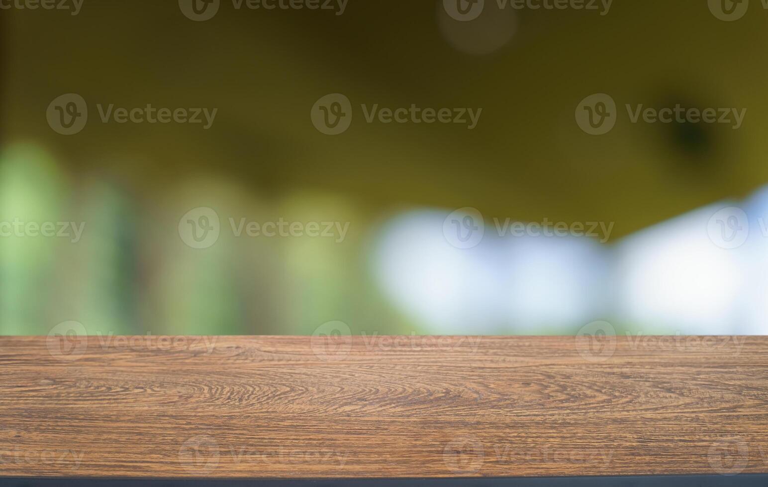 Empty wood table top and blur of restaurant background focus product display. photo