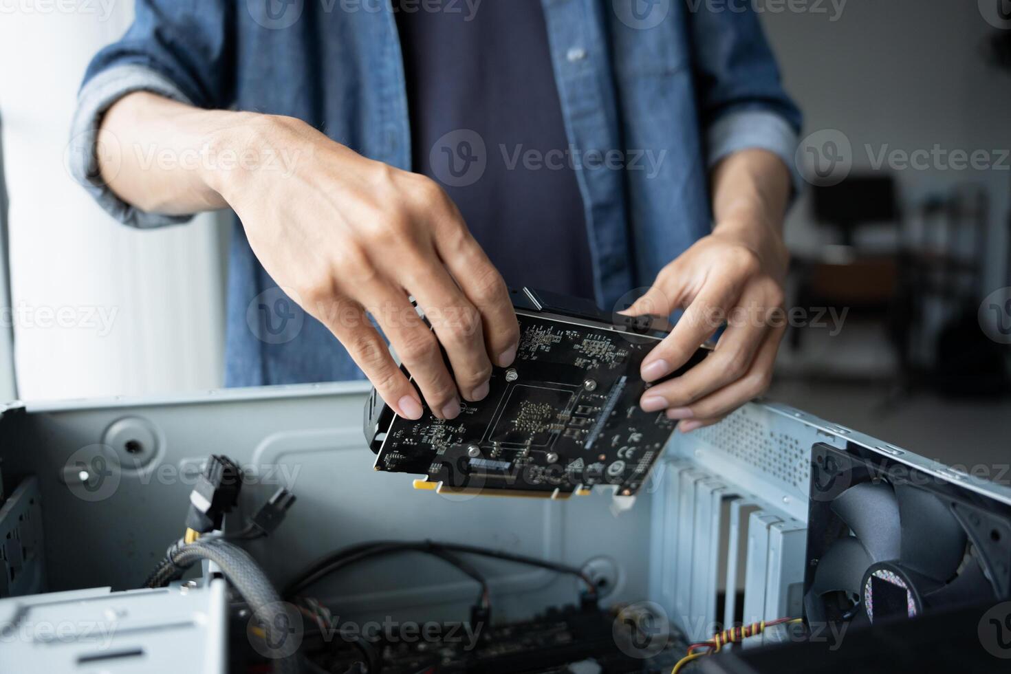 IT Engineer installing Hardware fixing a computer motherboard photo